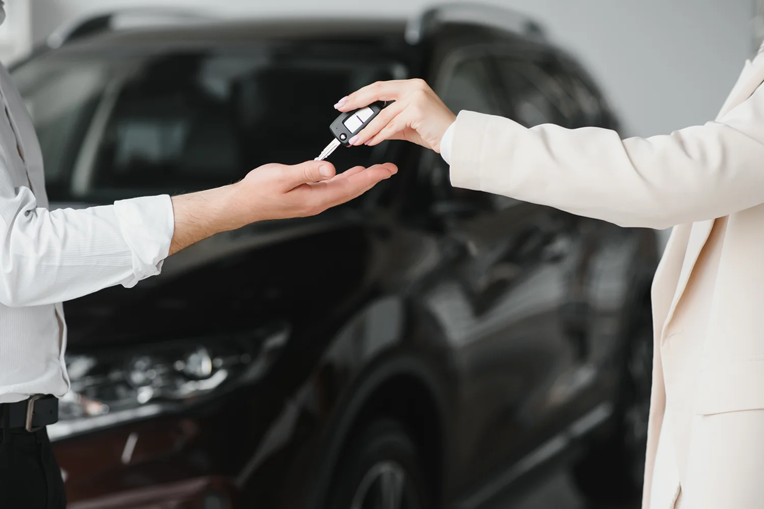 Client handing car keys to car transport company