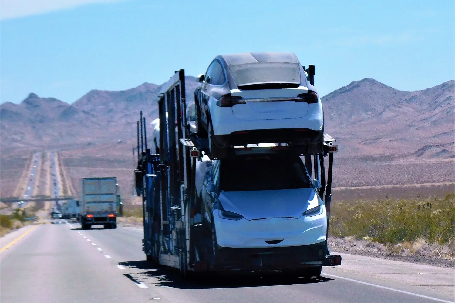 Car Trailer hitting the road while carrying cars